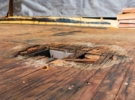 Image of a major area of wooden rot on a wooden deck.