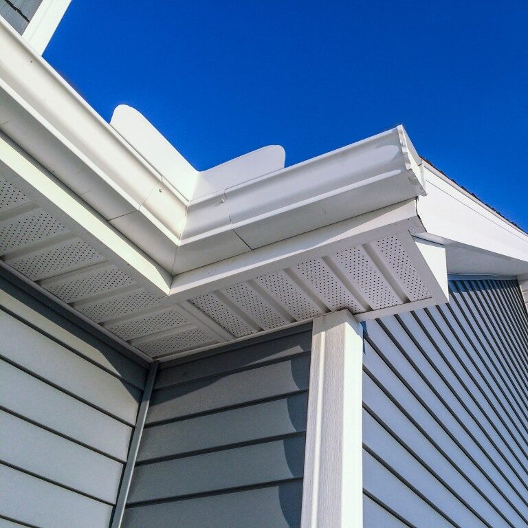 Image of clean and well maintained gray siding of a Connecticut home.